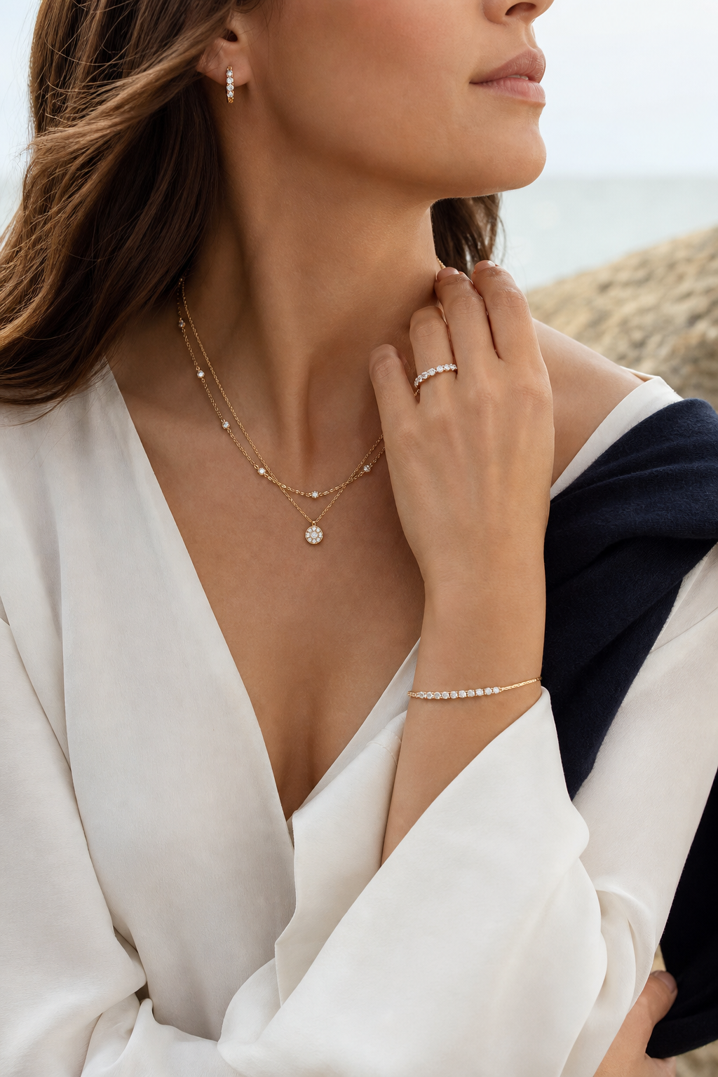Model wearing gold and diamond fine jewelry